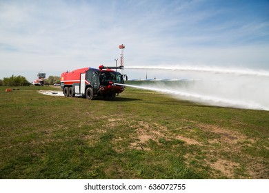 Boryspil, Ukraine - APRIL 27, 2017: Firefighters Training. Fire Truck In Action. Airport Firefighting.