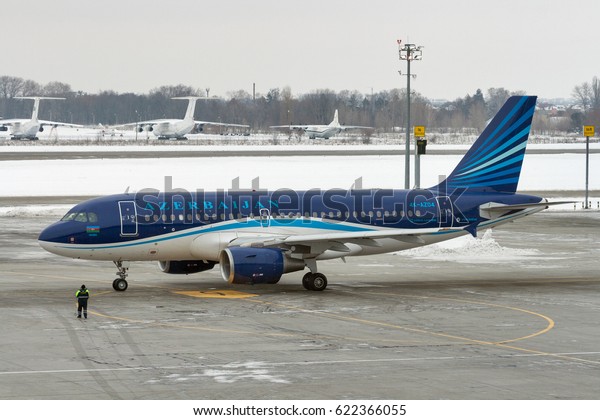BORYSPIL, UKRAINE - FEBRUARY 02, 2015: Airbus\
A319-100 of Azerbaijan Airlines parked in Boryspil International\
Airport. It is the country\'s largest airport, serving over 8\
million passengers per\
year.