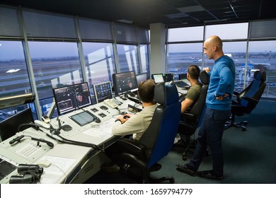 BORYSPIL, UKRAINE - OCTOBER 18, 2019:  Air Traffic Controllers At Work. Airport Air Traffic Control Tower. Aviation Radar Screen.