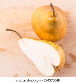 Bosc Pear Fruit On Wooden Surface