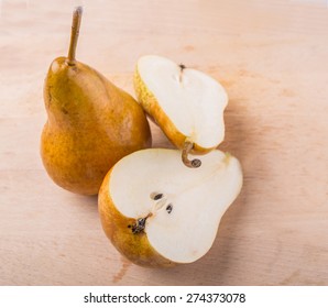 Bosc Pear Fruit On Wooden Surface