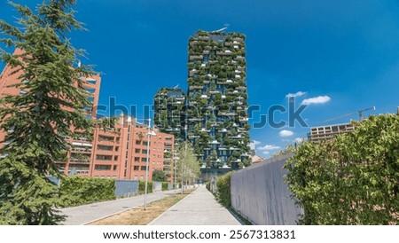 Bosco Verticale or Vertical Forest. It is a pair of two residential towers in the district of Porta Nuova, Milan. they host hundreds of trees and plants in the balconies. Blue cloudy sky at summer day Foto d'archivio © 