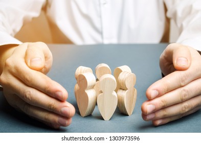 Boss defending his team with a gesture of protection. Life insurance. Customer care, care for employees. Security and safety in a business team. Human resources. A responsibility. Social protection - Shutterstock ID 1303973596