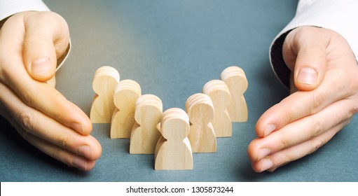 Boss defending his team with a gesture of protection. Life insurance. Customer care, care for employees. Security and safety in a business team. Human resources. A responsibility. Social protection - Shutterstock ID 1305873244