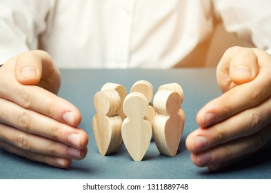Boss defending his team with a gesture of protection. Life insurance. Customer care, care for employees. Security and safety in a business team. Human resources. A responsibility. Social protection - Shutterstock ID 1311889748