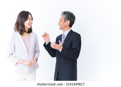 Boss and employee talking amicably - Shutterstock ID 2141449817