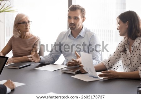 Boss explaining current state of project, challenges, next steps, clarifying terms for agreement, negotiating contract details, discussing responsibilities during formal meeting with business partners