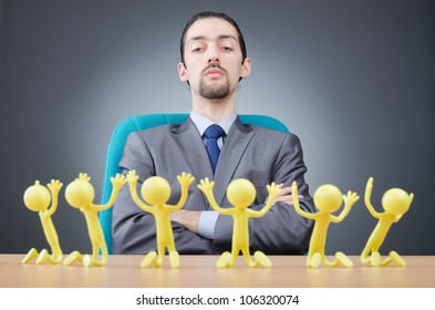 Boss With Figures Of His Subordinates