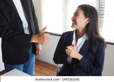 Boss Giving Thumbs Up To His Female Colleague After Work Done Reaching The Assigned Sales Target To Encourage His Team And Feeling Thankful For Her Effort. Happy Workplace, Productive Working Concept