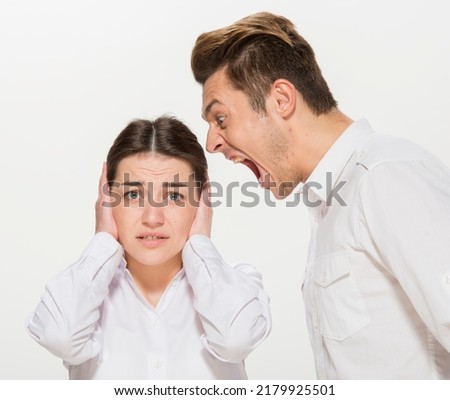 the boss scolds the young subordinate.close-up portrait of two workers on a white background isolated.the man yells at the girl.teaches the girl.points out the mistakes. Foto stock © 