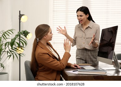 Boss screaming at employee in office. Toxic work environment - Shutterstock ID 2018107628