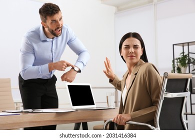 Boss screaming at employee in office. Toxic work environment - Shutterstock ID 2031416384
