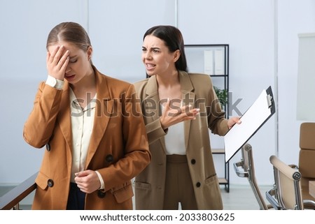 Boss screaming at employee in office. Toxic work environment