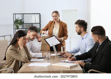 Boss screaming at employees in office. Toxic work environment - Shutterstock ID 2027973893