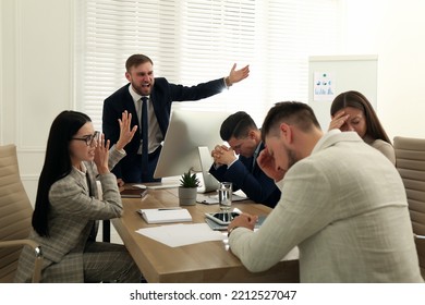 Boss screaming at employees on meeting in office. Toxic work environment - Shutterstock ID 2212527047