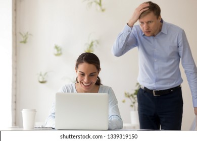 Boss Shocked Seeing Lazy Female Worker Playing Computer. Stressed Manager Notice Excited Smiling Woman Watching Funny Video At Work. Boyfriend Jealous Girlfriend Chatting Other Guy. People At Work