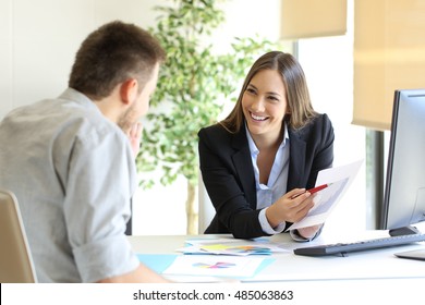 Boss Showing A Good Job Congratulating An Employee At Office