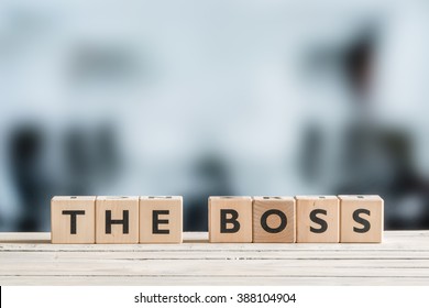 The Boss Sign On A Wooden Office Desk