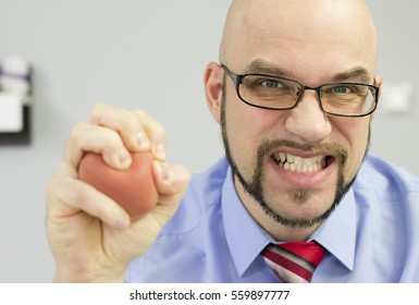 Boss Squeezing Stress Ball In The Office - Dissapointed Manager.