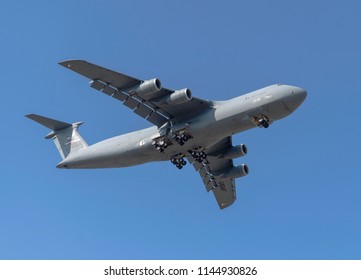 BOSSIER CITY, LA., U.S.A. - JULY 25, 2018: A U.S. Air Force C-5 Galaxy passes over the city in its approach to Barksdale Air Force Base. - Powered by Shutterstock