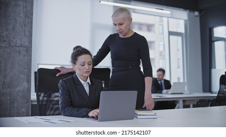 Bossy Business Lady Annoyed With Employee's Work Results, Criticizing Upset Colleague