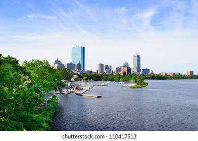 Boston Back Bay With Sailing Boat And Urban Building City Skyline In The Morning.