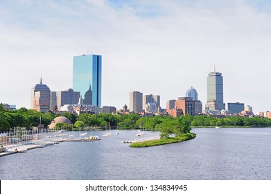 Boston Back Bay With Sailing Boat And Urban Building City Skyline In The Morning.