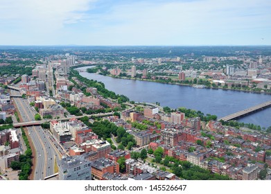 Boston City Aerial View With Urban Buildings And Highway With Charles River In Cambridge District.