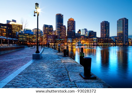 Boston Harbor and Financial District in Boston, Massachusetts in the sunset.