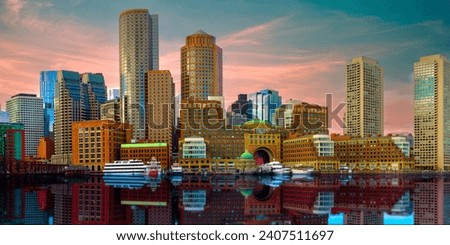 Boston Harbor and Financial District Skyline Panorama at sunset with vibrant colors of the clouds, buildings, and reflections in Massachusetts, USA