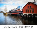 Boston Harbor Seascape with Tea Party Ships and Landmark Museum Buildings in in Massachusetts, USA: A tranquil New England evening cityscape at the waterfront