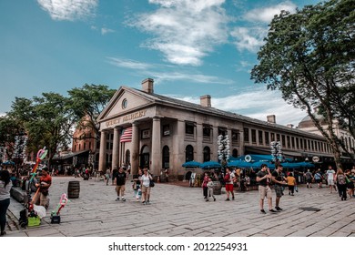 BOSTON - JULY 12: People visit famous Quincy Market on July 12, 2019 in Boston. Quincy Market dates back to 1825 and is a major tourism destination in Boston.
