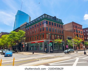 BOSTON - JUN. 5, 2022: Historic commercial building at 125 Causeway Street at Canal Street with State Street building at the background in West End Boston, Massachusetts MA, USA. 