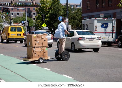 BOSTON - JUNE 15: Segway PT Hauling A Trailer On June 15, 2012 In North End, Boston, MA