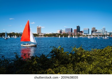 Boston landscape over Charles River with red and white yachts. Tranquil River scape from Charles River Esplanades.