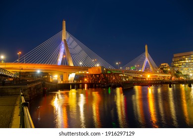 Boston Leonard P. Zakim Bunker Hill Memorial Bridge and Charles River at night with twilight, Boston, Massachusetts MA, USA.
