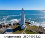 Boston Lighthouse on Little Brewster Island in Boston Harbor, Boston, Massachusetts MA, USA.