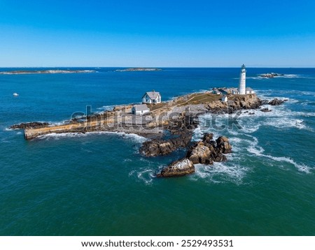 Boston Lighthouse on Little Brewster Island in Boston Harbor, Boston, Massachusetts MA, USA.