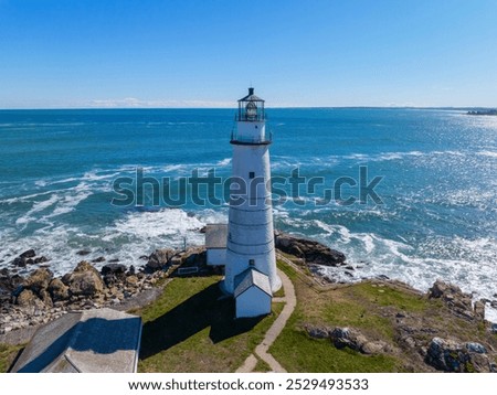 Boston Lighthouse on Little Brewster Island in Boston Harbor, Boston, Massachusetts MA, USA.