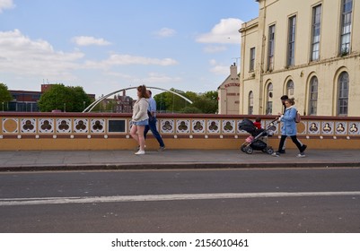 Boston, Lincolnshire, UK 04 30 2022 People walking across a road bridge                             