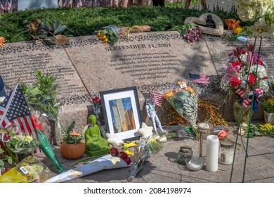 BOSTON, MA - 11 SEPTEMBER 2021: Candles And Flowers Left On The Massachusetts September 11th Memorial, On The Occasion Of The 20th Anniversary