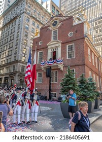 BOSTON, MA - 4 JULY 2022: A Colonial Color Guard Marches Past The Historic Old State House, America's Oldest Public Building