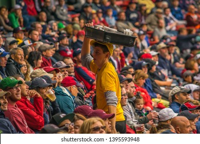 Boston, MA - 9/30/17: A Fenway Park vendor sells hot dogs to Red Sox fans at a baseball game