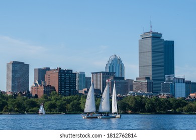 BOSTON, MA - AUGUST 8, 2020 : People sailing yachts in the Charles River in Boston