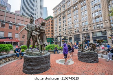 BOSTON, MA - July 3, 2021: View From The Boston Irish Famine Memorial Park Containing Two Groups Of Statues Depicting Two Families, One Starving And The Other Prosperous.