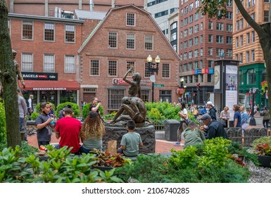 BOSTON, MA - July 3, 2021: View From The Boston Irish Famine Memorial Park Showing The Statue Of A Poor Family Starving During The Great Hunger.