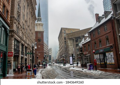 Boston, MA, USA - Dec 17, 2016: People Out Walking Down The Street. Snowstorm In Boston