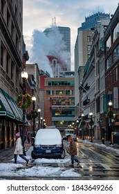 Boston, MA, USA - Dec 17, 2016: People Out Walking Down The Street. Snowstorm In Boston