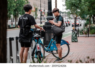 BOSTON, MA, USA - JULY 18, 2019: Tourist And Public Bicycles For Rental Rides With The Blue Cross Blue Shield Logo.