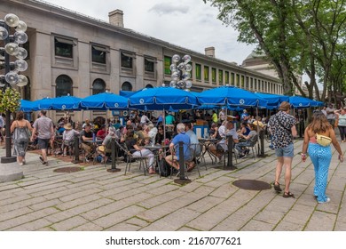 Boston, MA, US-June 11, 2022: People Eating At Outdoor Restaurant In Summer At Busy Tourist Destination.